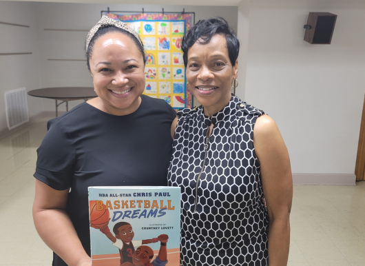 Executive Director poses with Freedom School reader